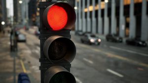 What Are the Rules for Drivers at a Red Light or Stop Sign?